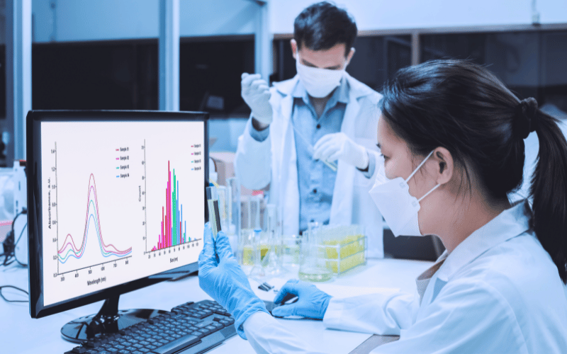 male and female researchers conducting test tubes analysis